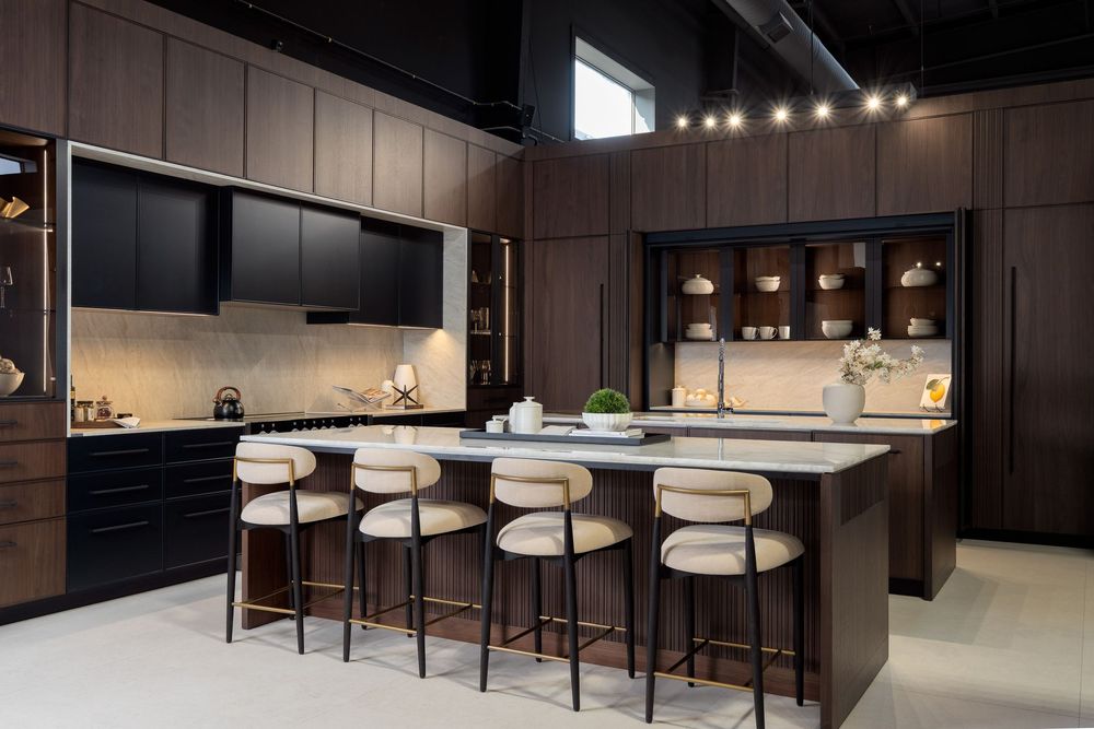 Sleek bar area with white counter seating and dark wood paneling in contemporary restaurant design.