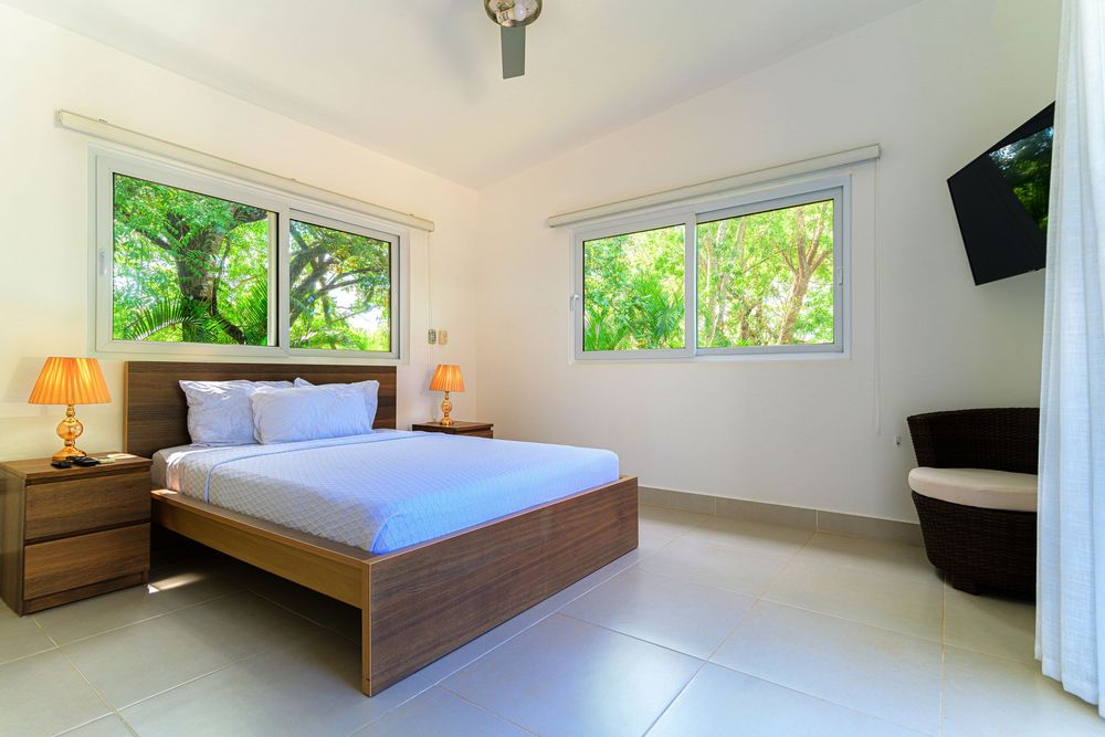 Spacious Sosua villa with 6 bedrooms, regulation pool table, 9 TVs, and tropical landscaping.