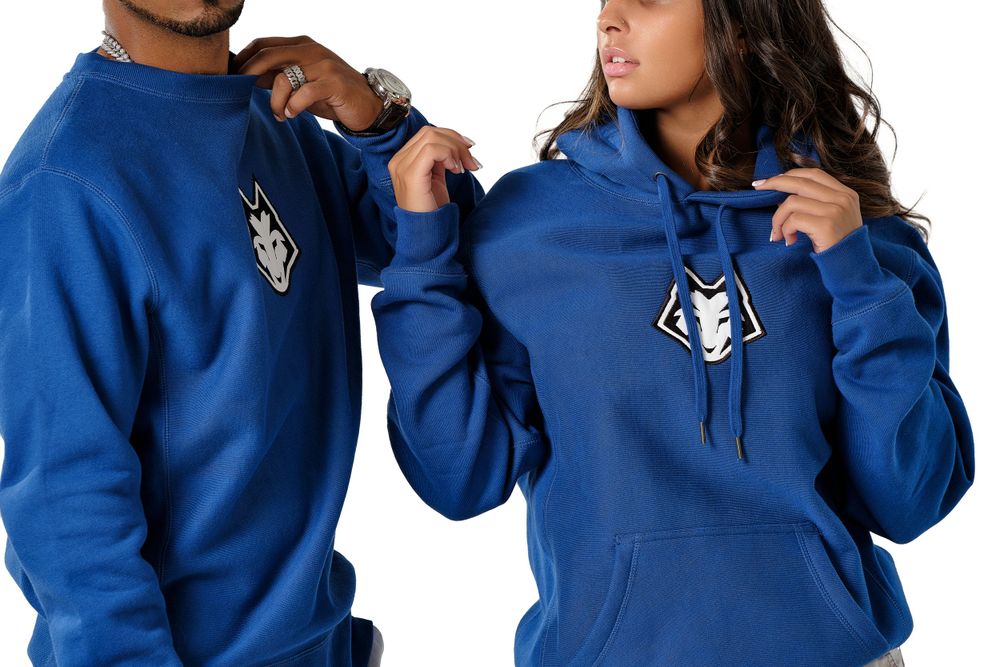 Close-up of blue hooded sweatshirts with embroidered logo details.