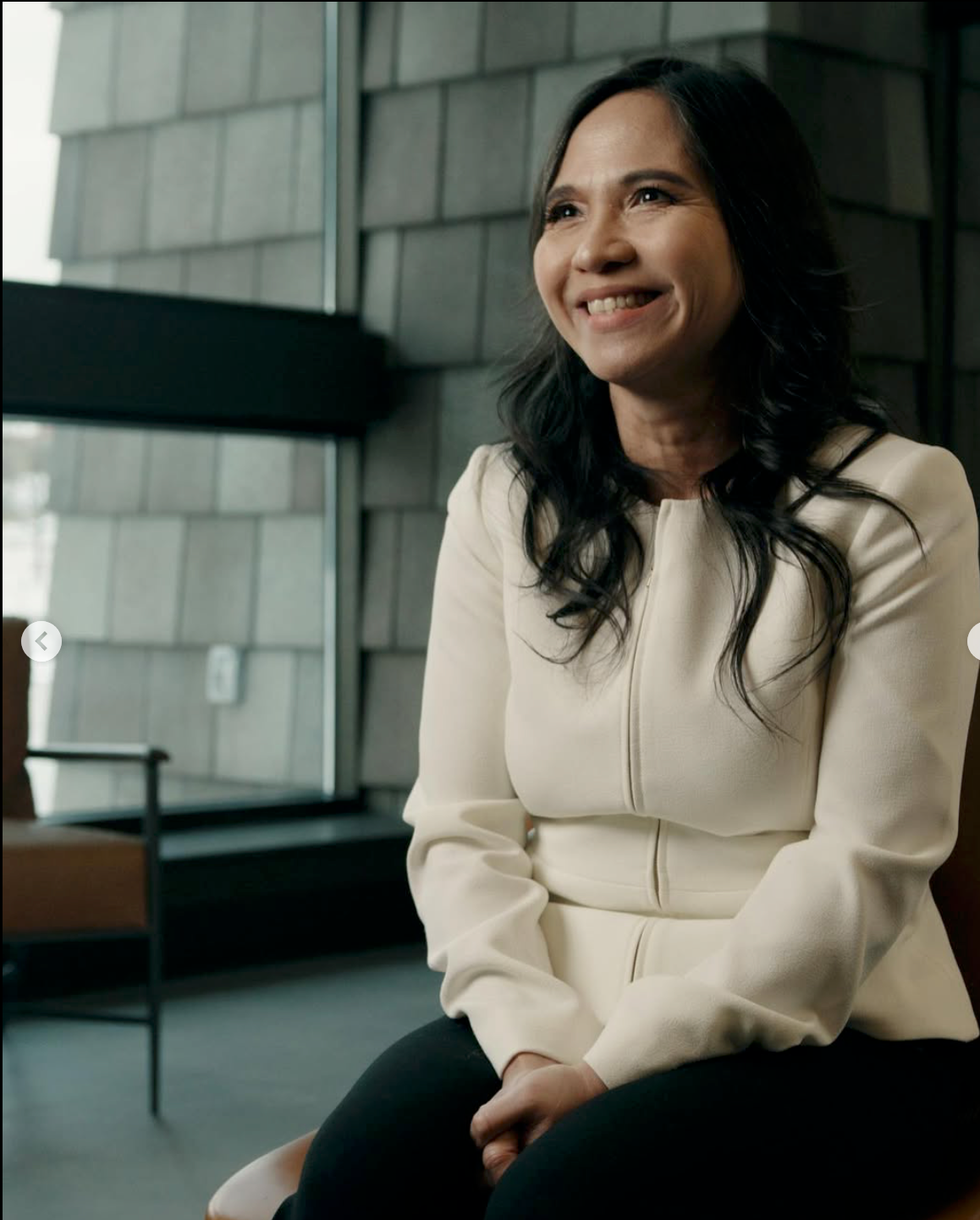 woman sitting and smiling