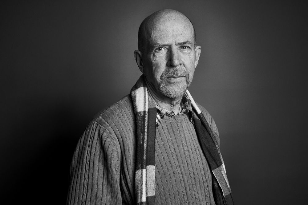 A black and white portrait series shows the same person in different poses wearing a sweater against a dark background.