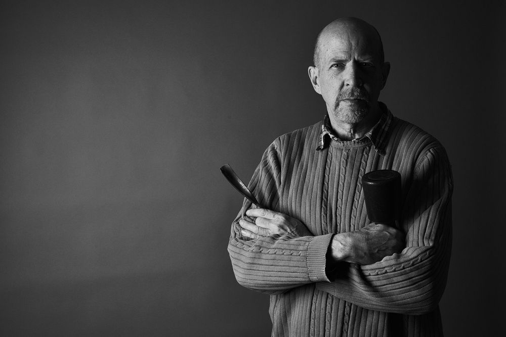 A dramatic black and white portrait series showing the same person in different poses and expressions.