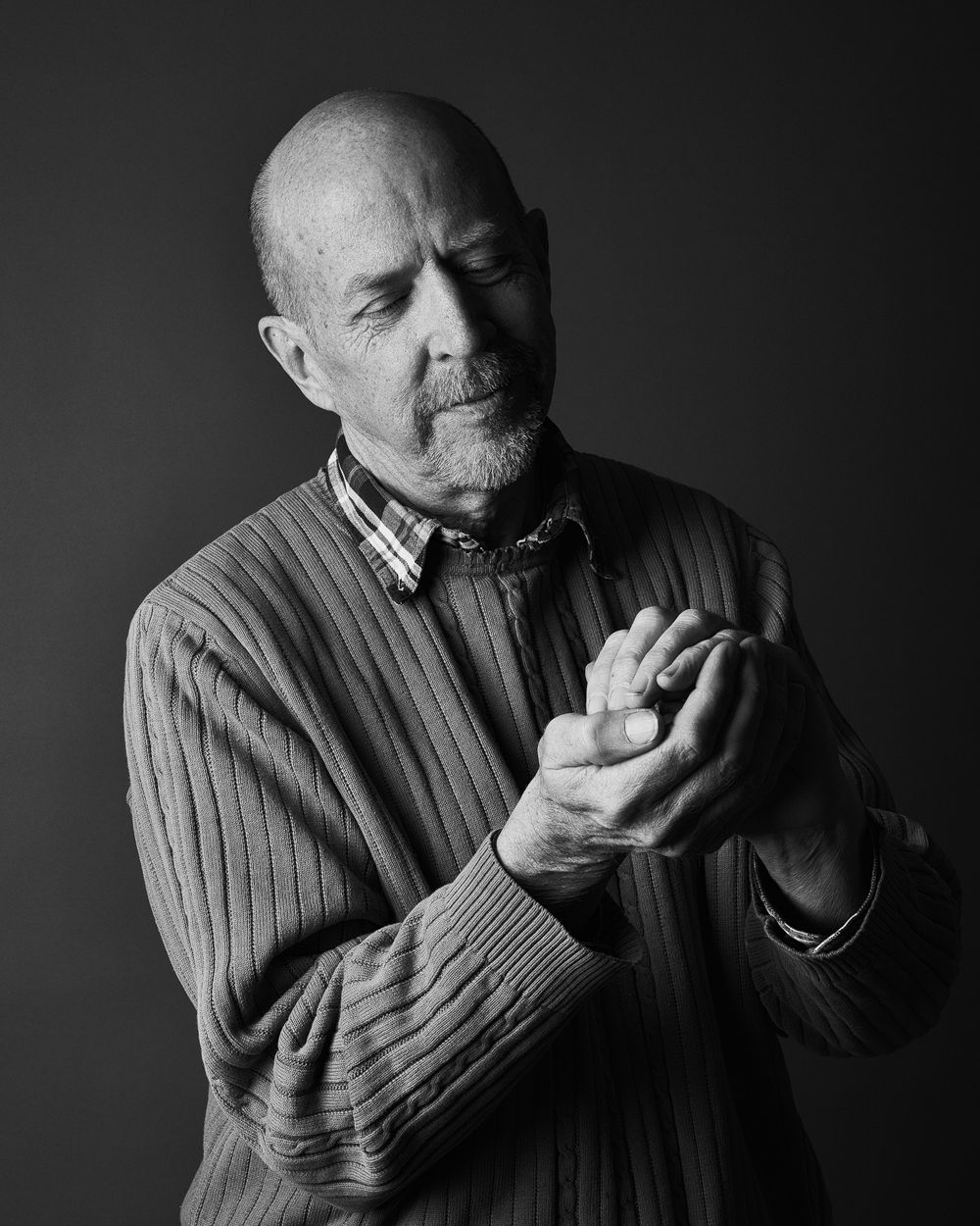 A dramatic black and white portrait series showing someone eating an apple in sequential frames.