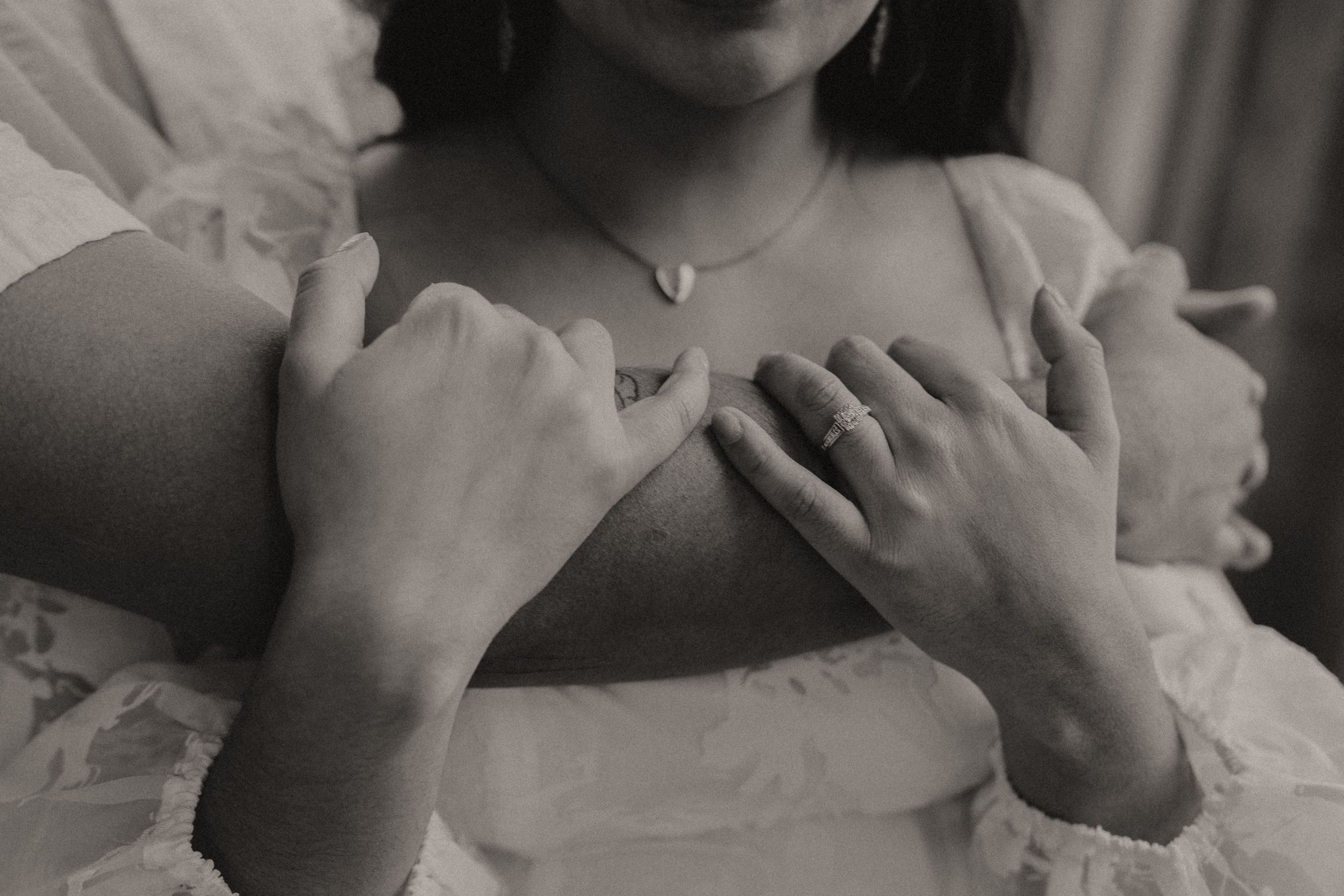Artistic black and white portrait with delicate lace details.
