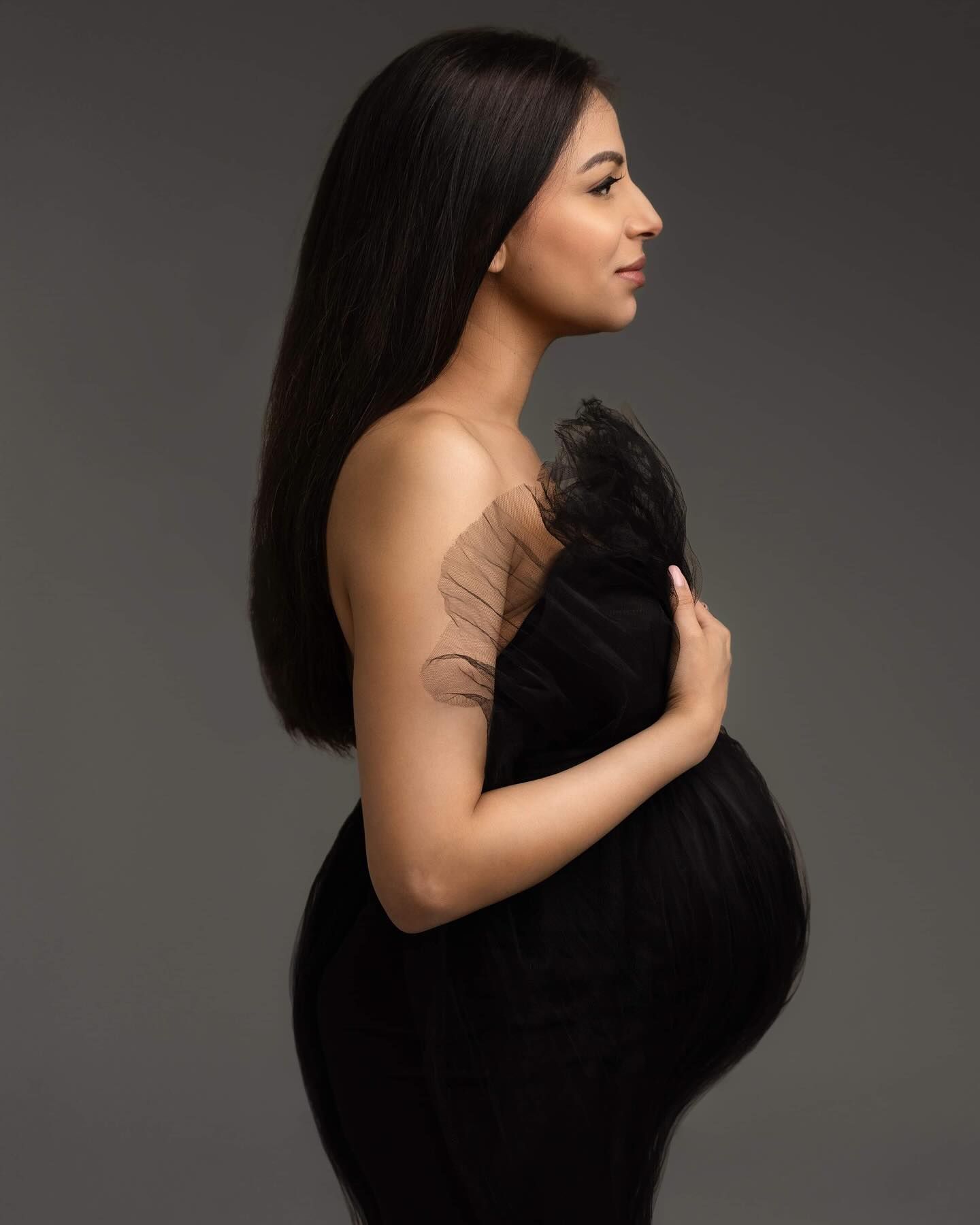 A woman in black dress poses against dark background in a series of artistic profile portraits.