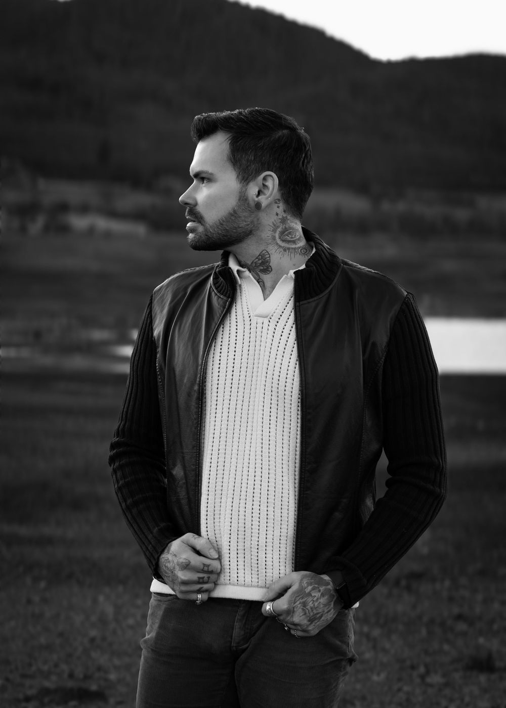 Standing male model with tattoos