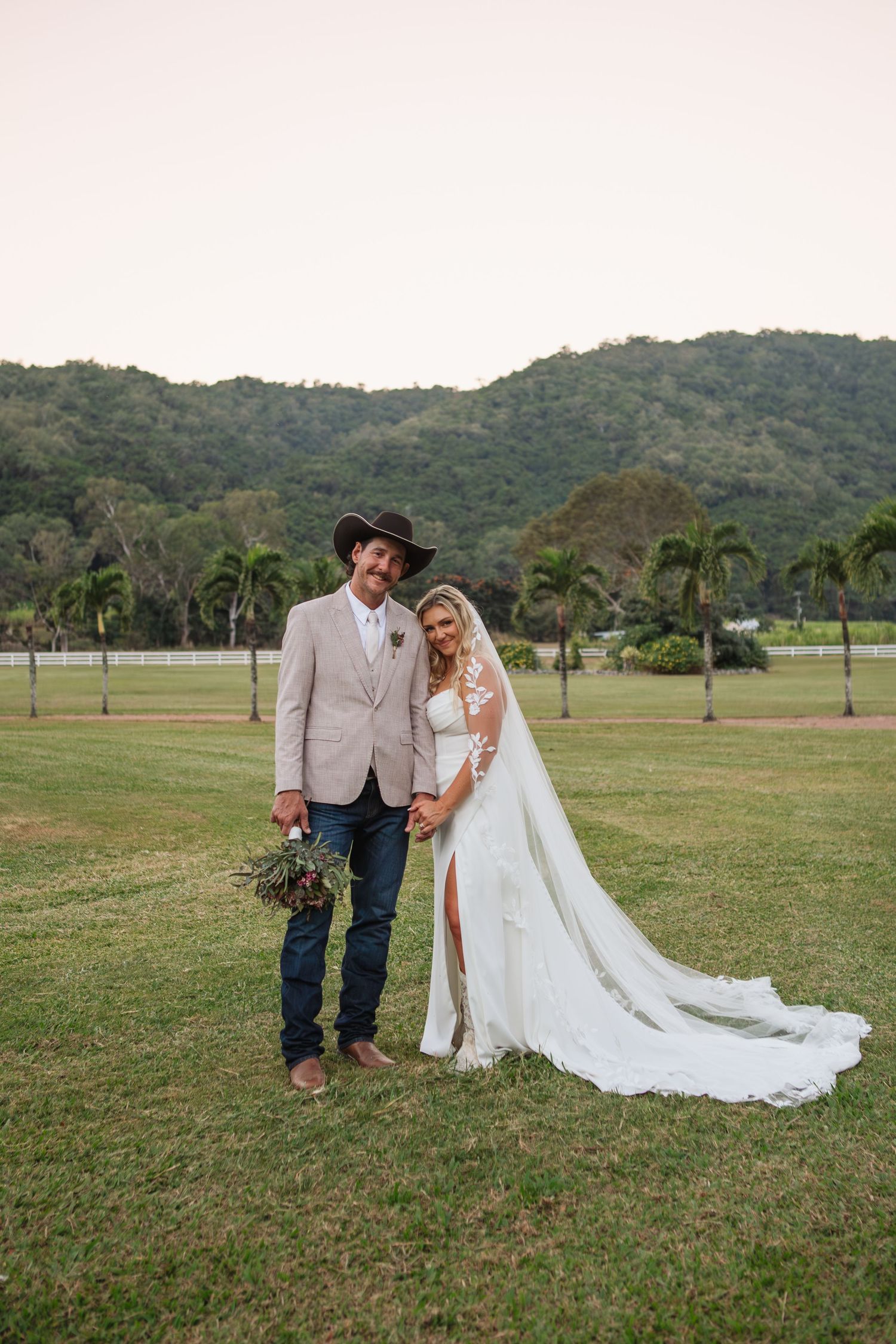Bride and groom holding hands at country Port Douglas Wedding