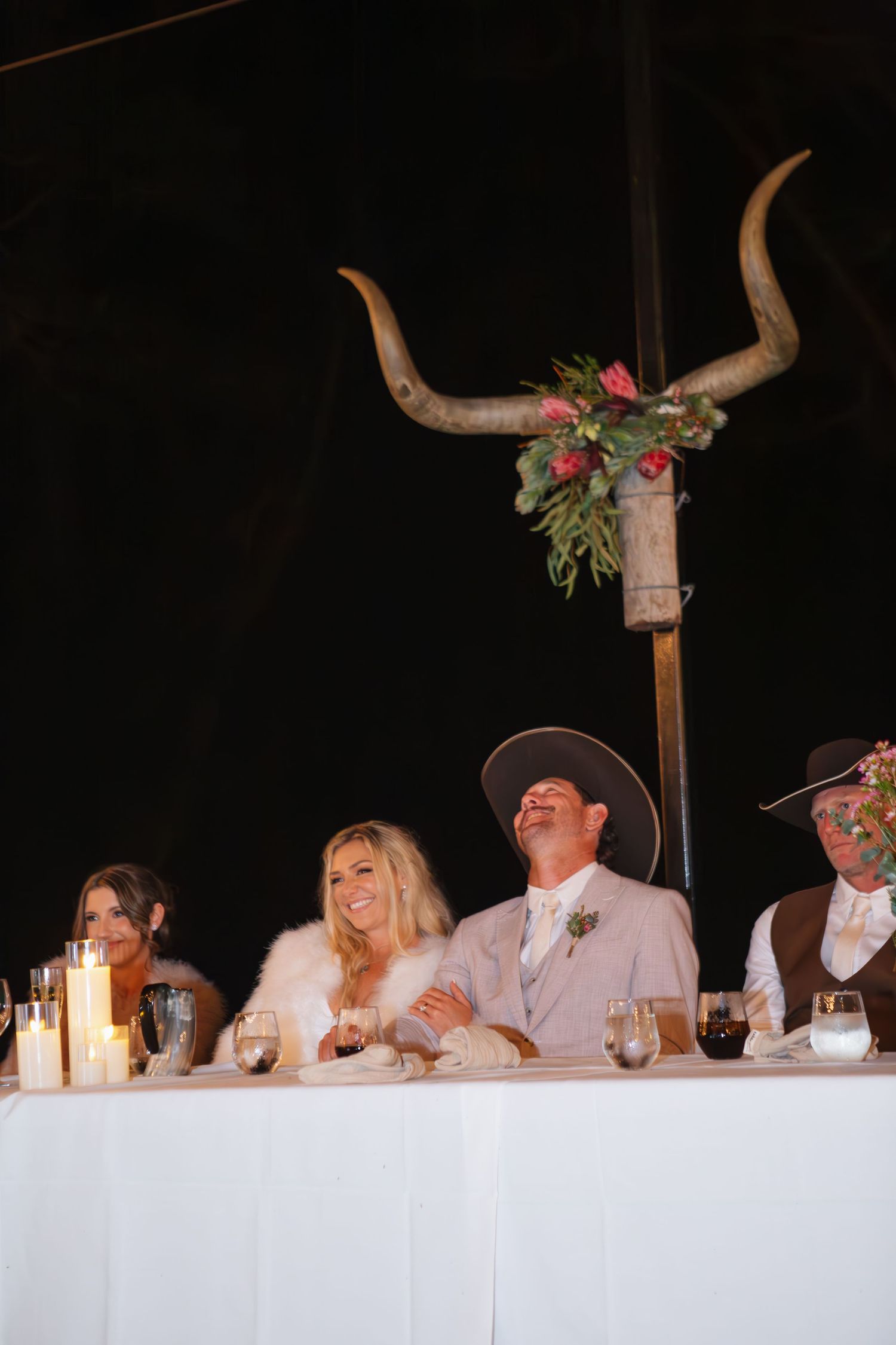 Bride and groom smiling and laughing during speeches at country Port Douglas Wedding