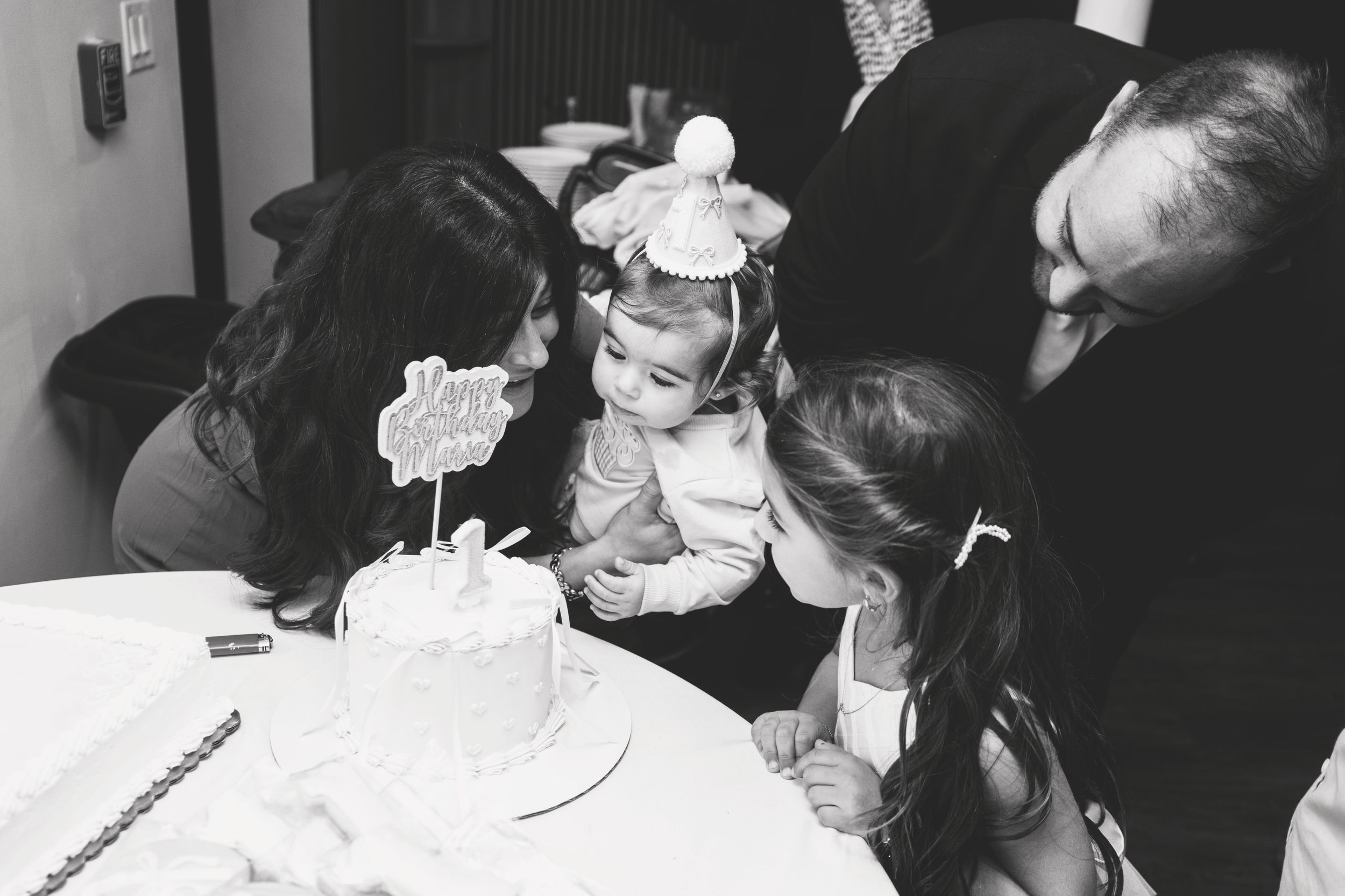 Black and white candid shots of guests enjoying a celebration event.