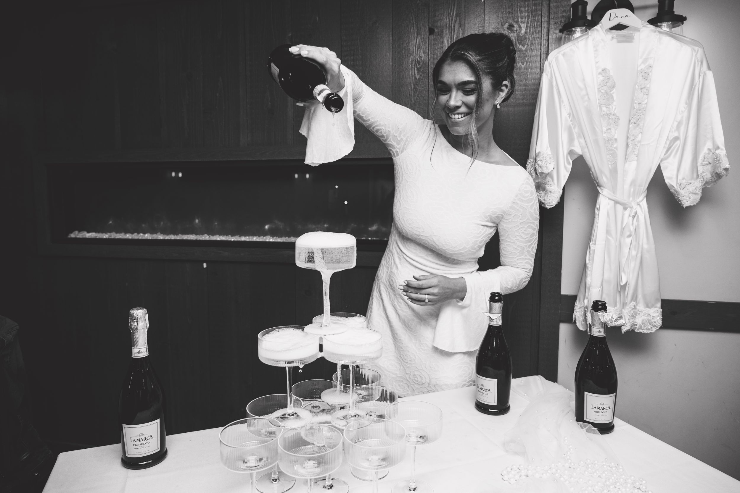 Black and white photos of people celebrating with champagne and drinks at an event.