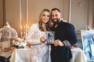 Wedding reception celebration with candlelit table settings and joyful moments.
