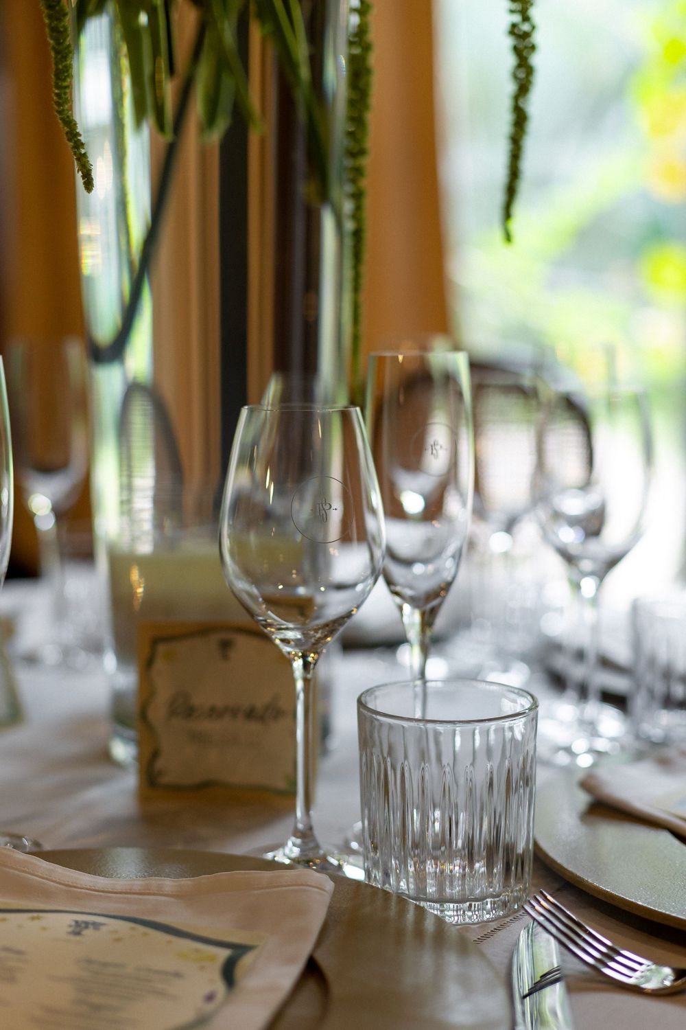 Crystal glassware and place settings arranged on an elegant dining table.