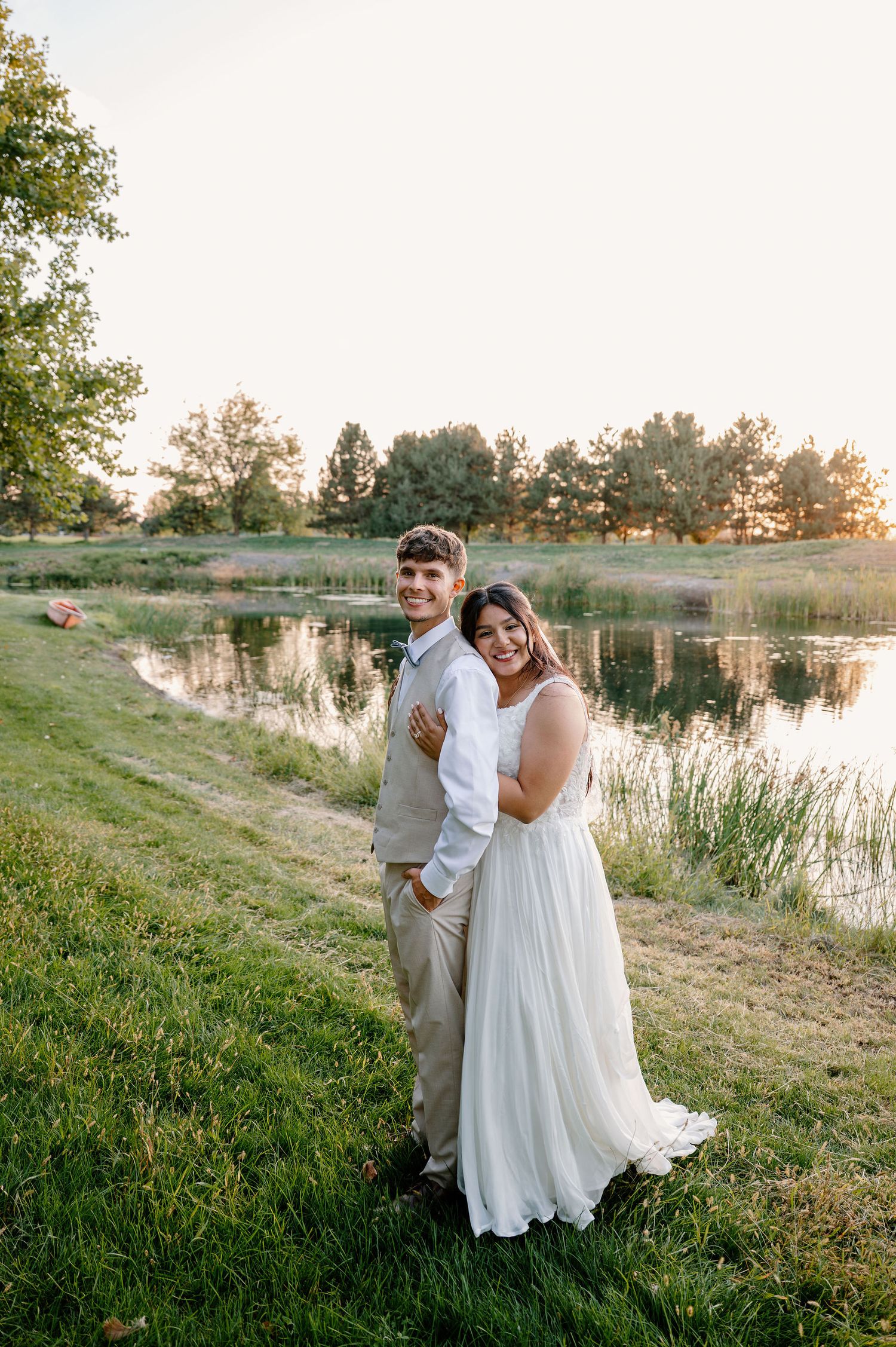 Outdoor wedding portraits near a pond in Oregon at sunset