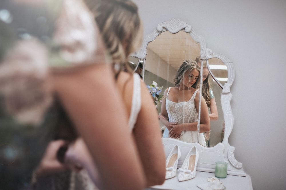 Wedding details including a delicate white dress and decorative accessories.
