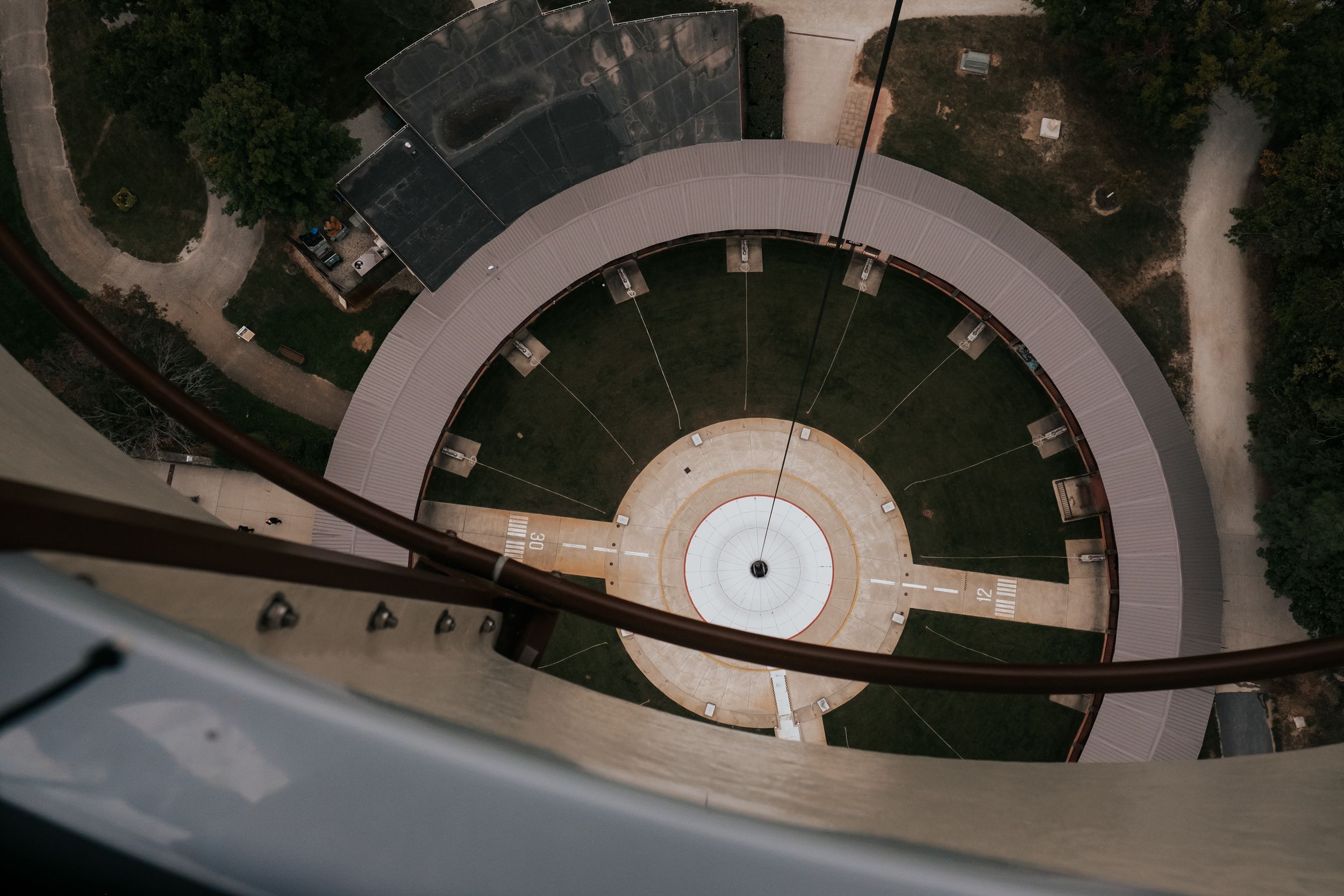 Aerial view of a circular garden pathway with geometric design patterns.