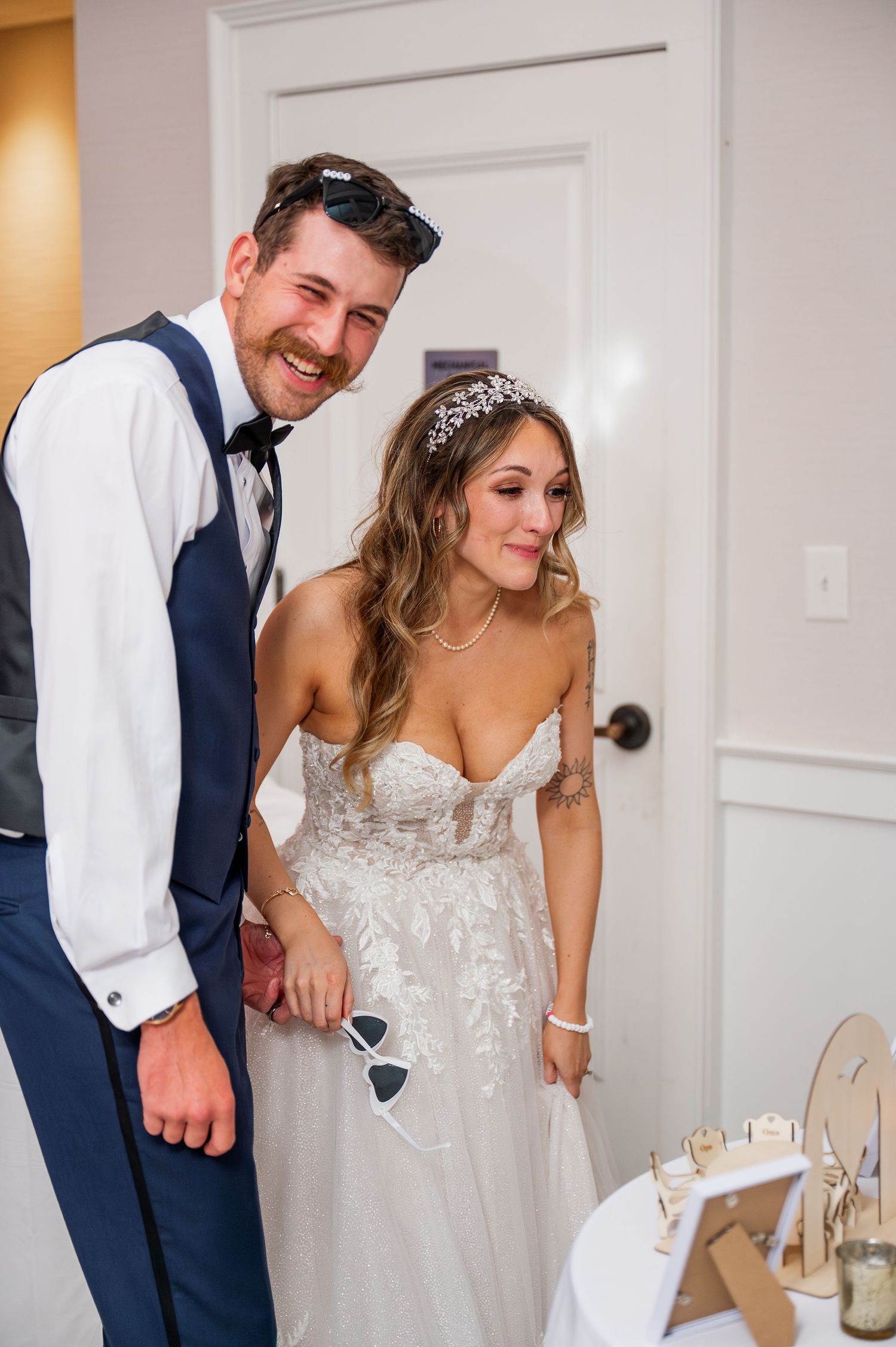 Newlyweds sharing a lighthearted moment together during their wedding celebration.