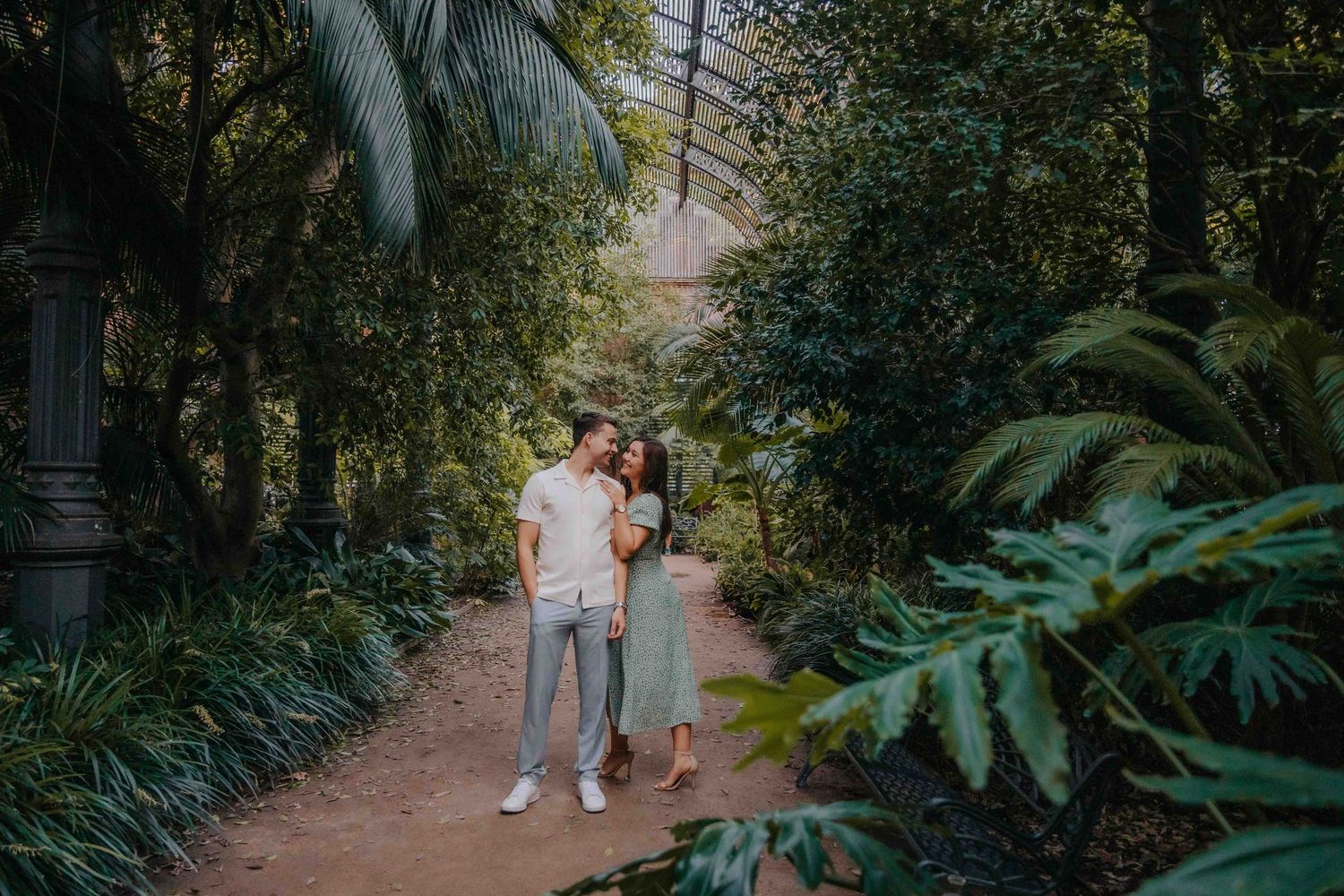 Couple walking down a park avenue feeling like the only two people.