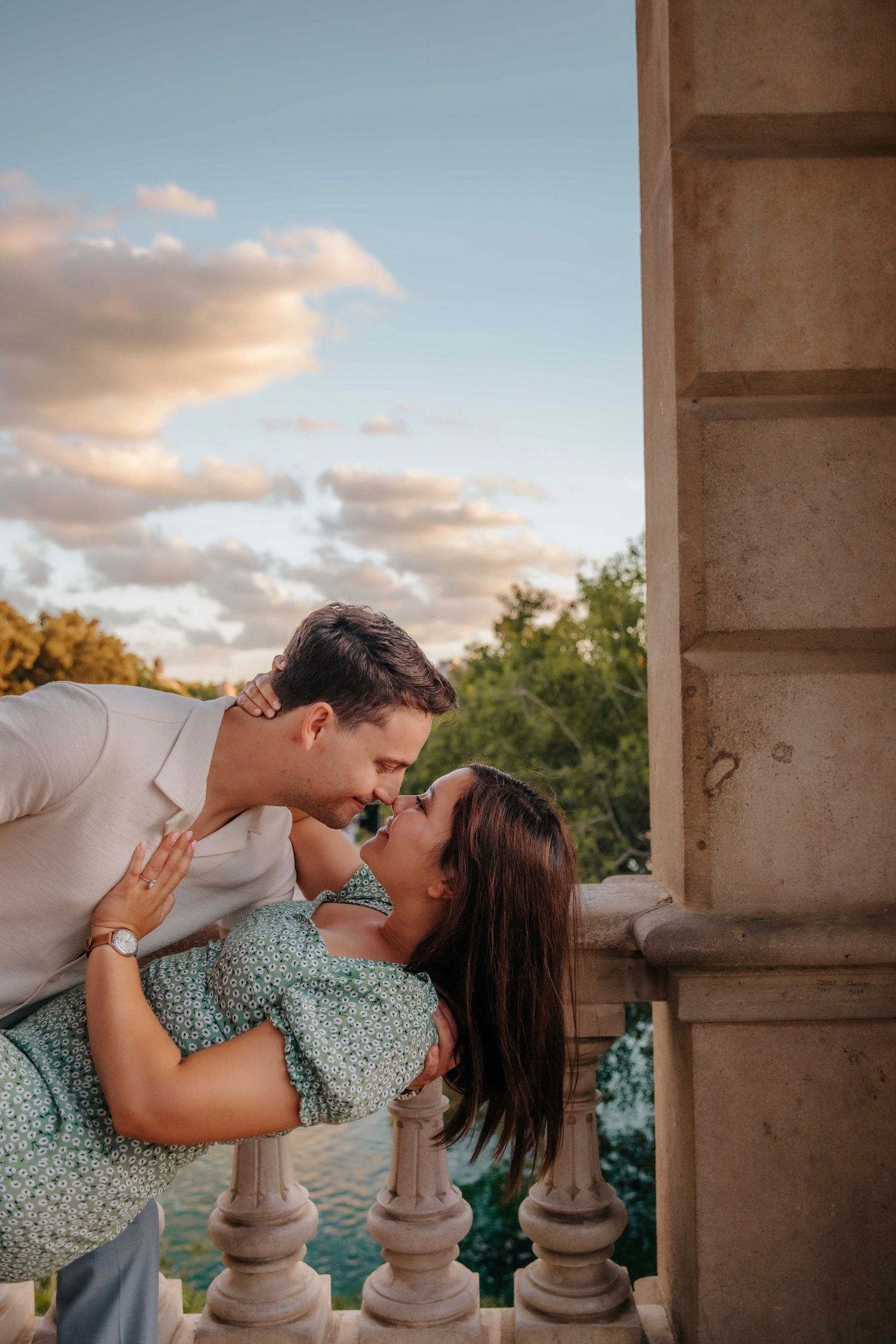 Romantic September afternoon light filtering through trees on couple.