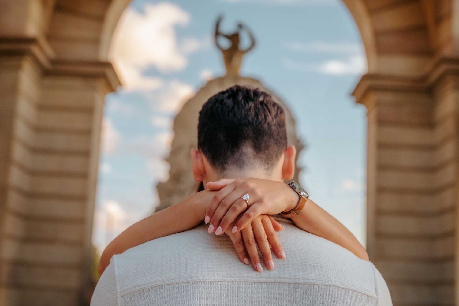 Markus hugging Chloe gently during natural couples photoshoot Barcelona.