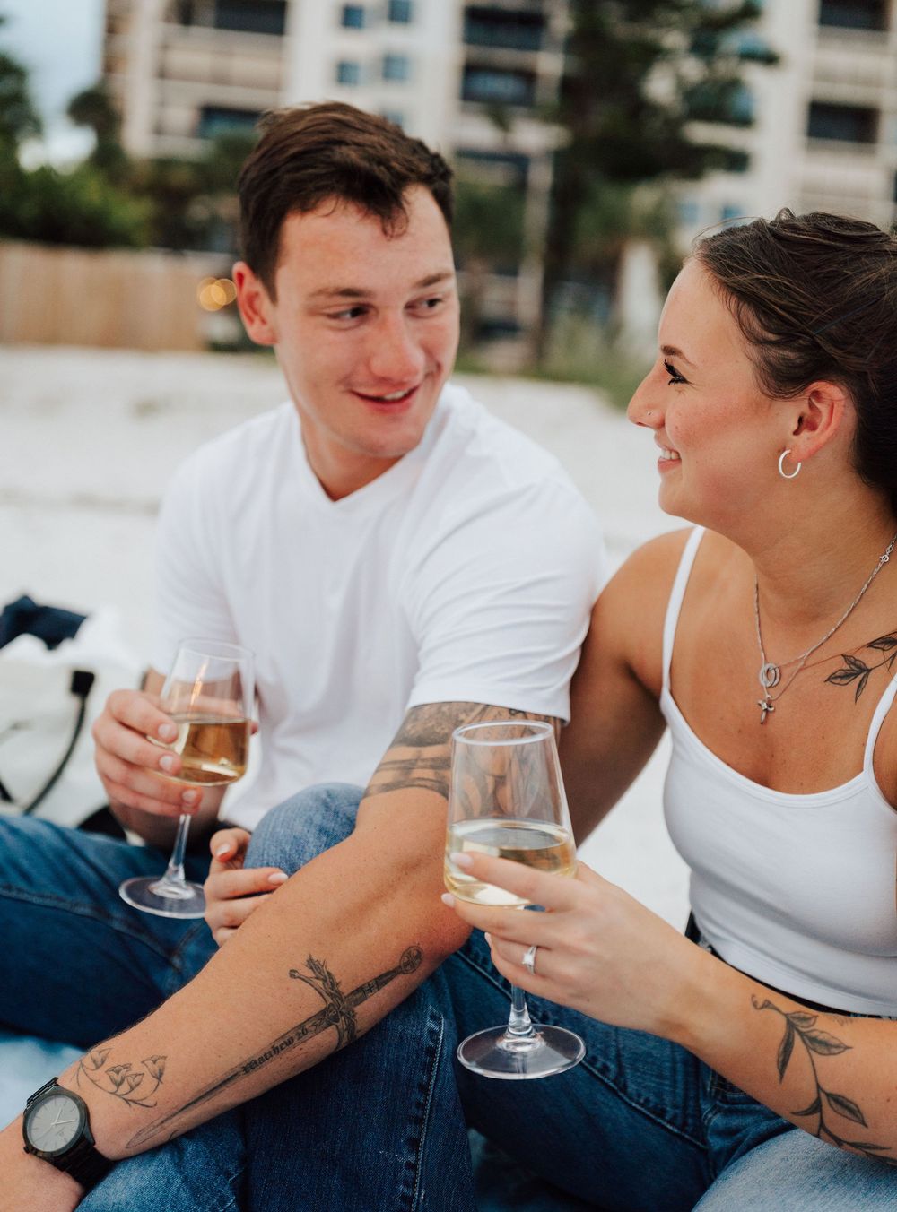 Engagement photoshoot on St. Pete Beach with picnic setup, wine, and relaxed Tampa Bay coastal vibes.