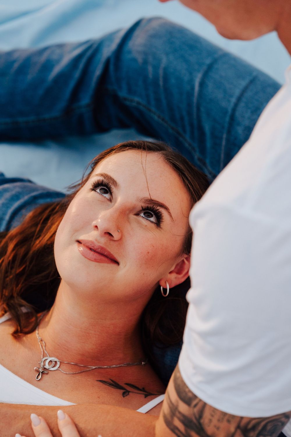 Engagement photoshoot on St. Pete Beach with picnic setup, wine, and relaxed Tampa Bay coastal vibes.