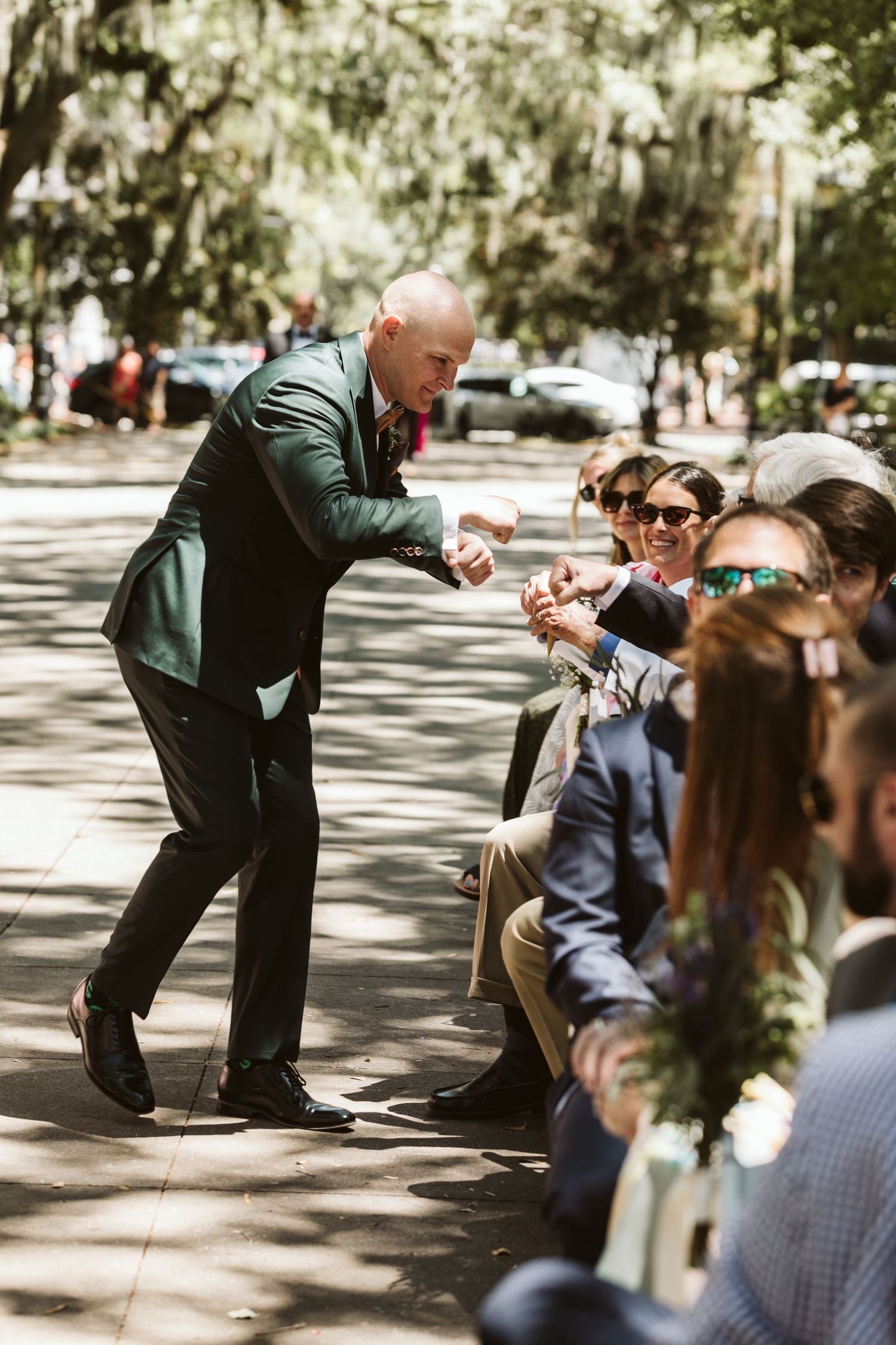 A sequence of candid photos shows a photographer crouching down to capture shots in a sunlit outdoor setting.