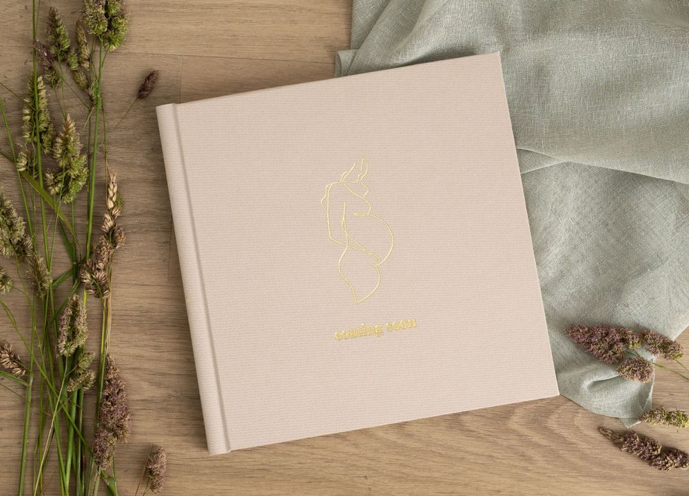 Hand-crafted luxury newborn album with linen cover and museum-grade printing.