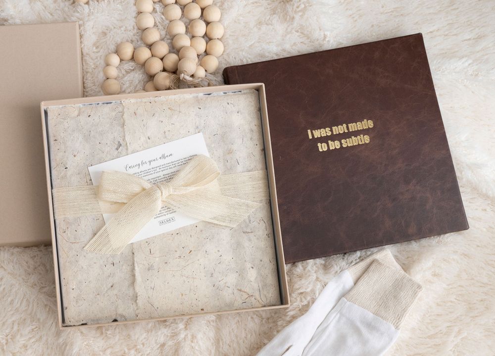 Detail shot of a handcrafted Italian leather family album by Genesis Imagery.
