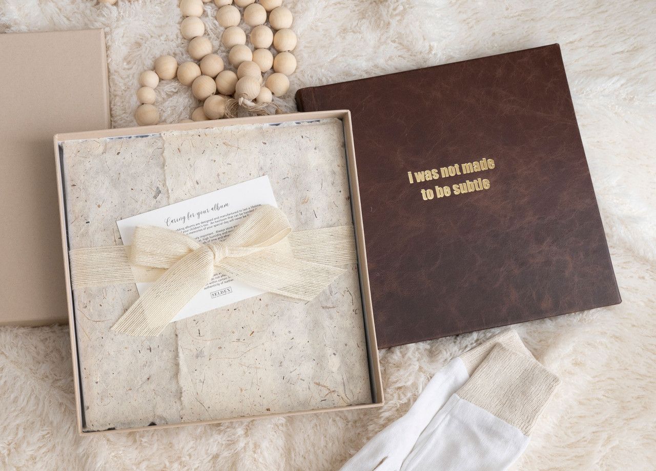 Detail shot of a handcrafted Italian leather family album by Genesis Imagery.