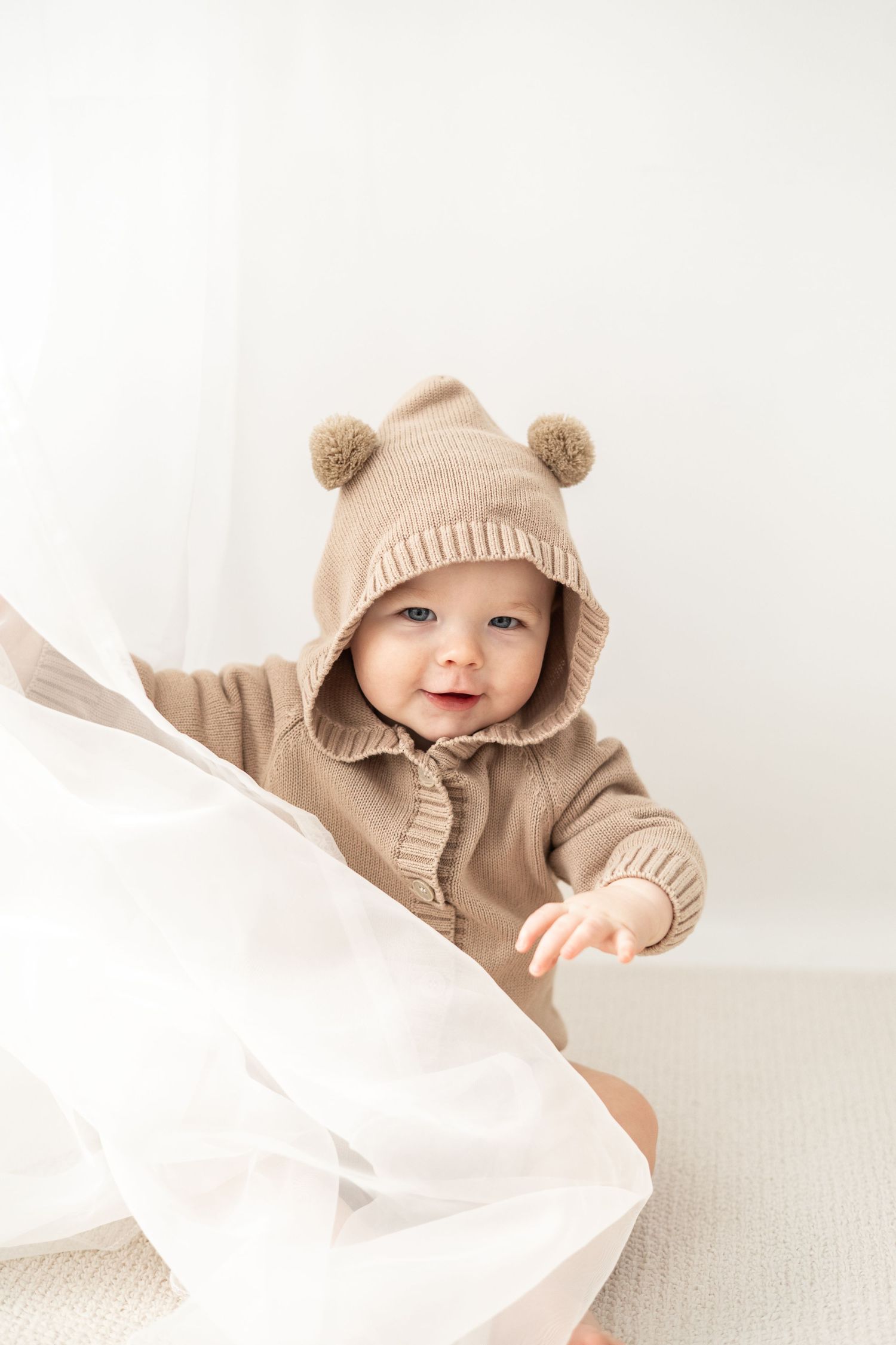 First birthday photoshoot Nottingham neutral studio baby sitting portrait