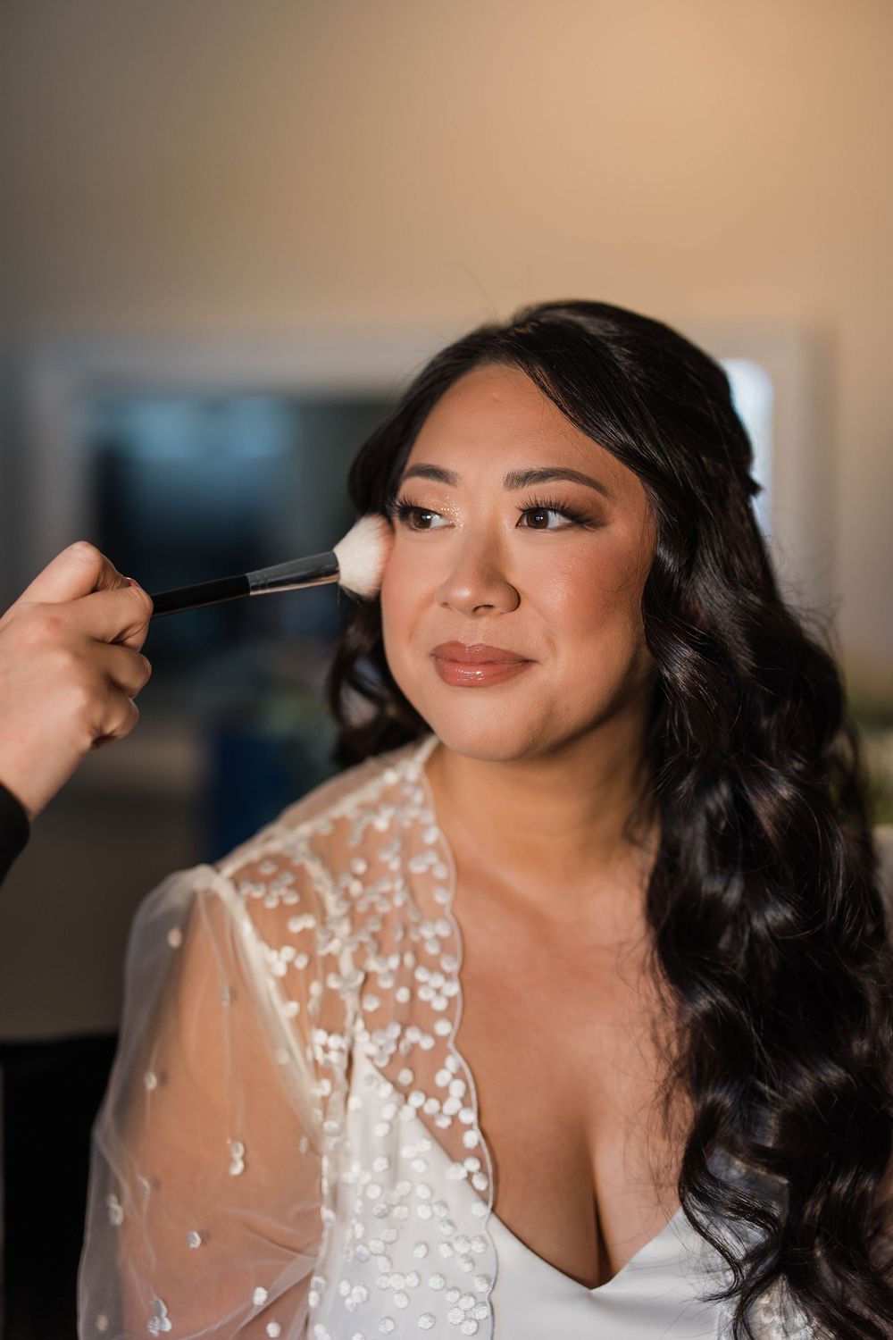 Bride getting ready with makeup artist applying mascara in sequence of photos showing beauty preparation.