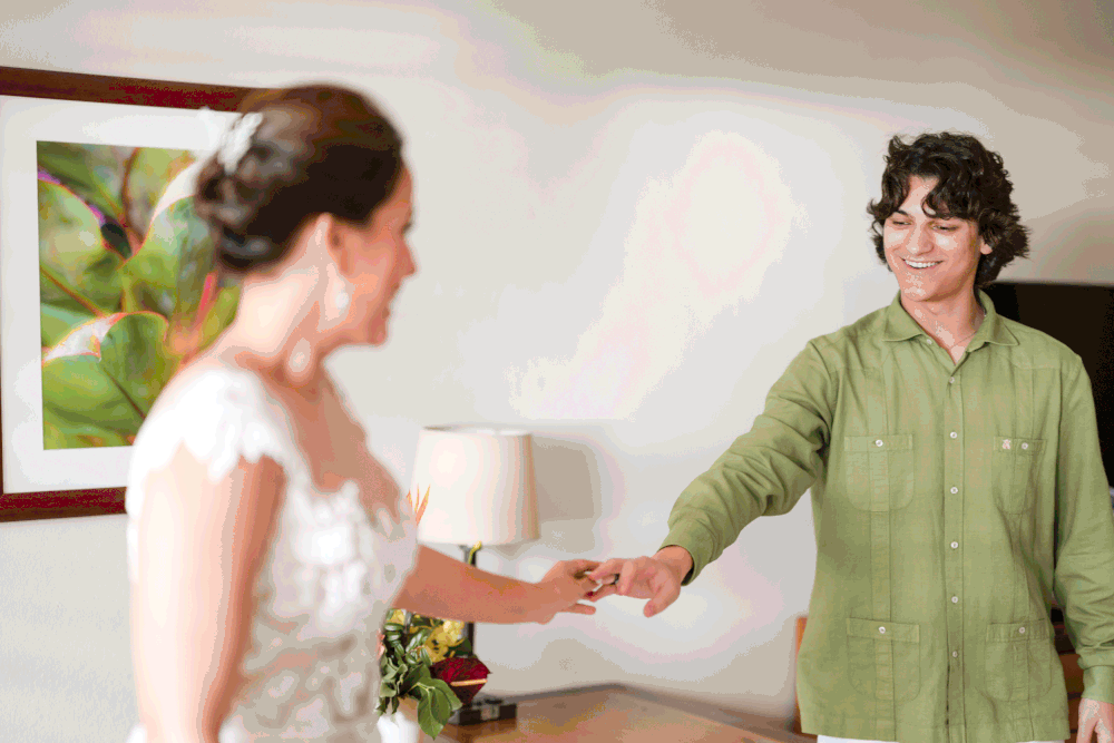 Bride dancing with bridesmaid during wedding preparation at Copamarina Puerto Rico