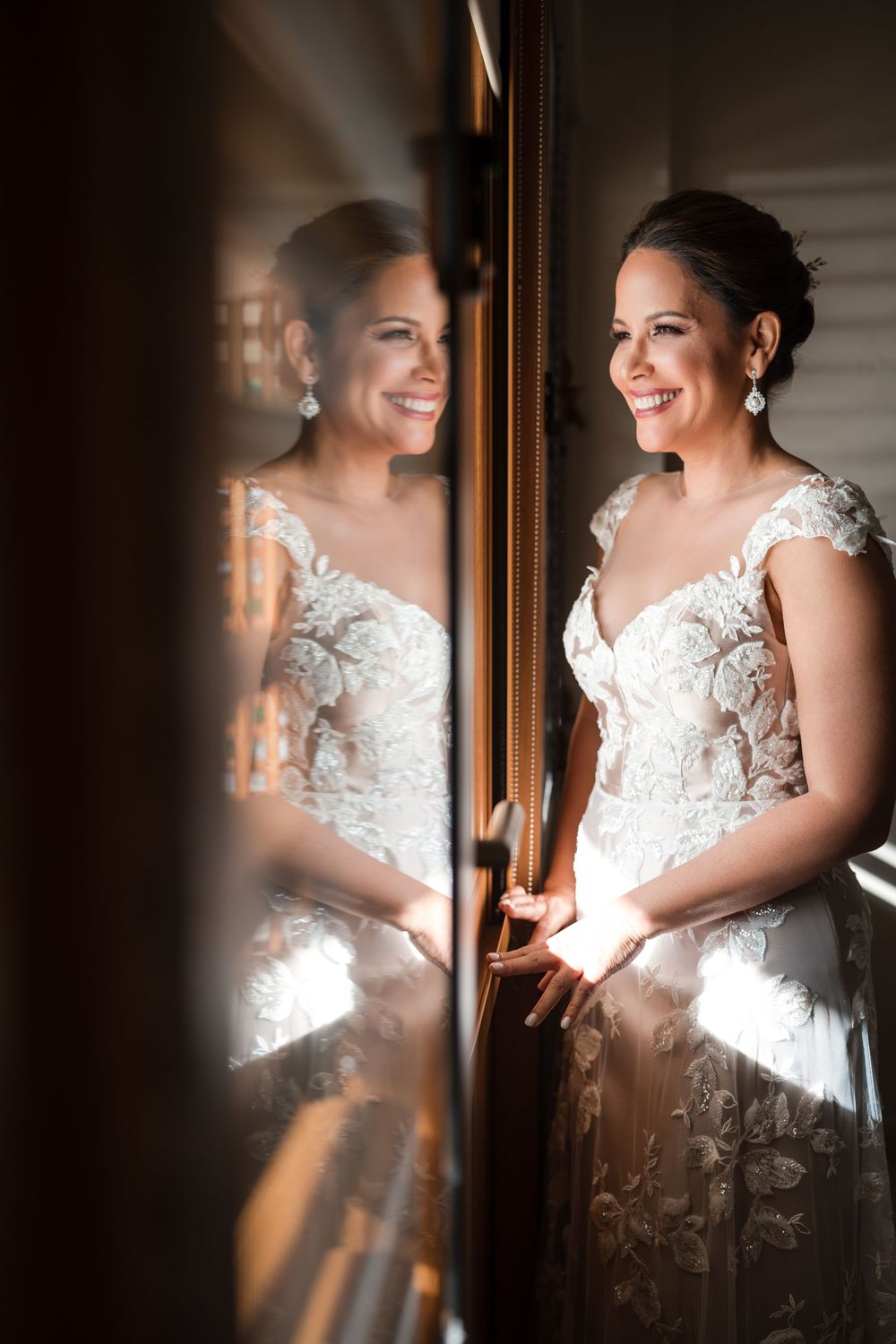 Bride getting ready with reflection in mirror during wedding day in Guanica Puerto Rico