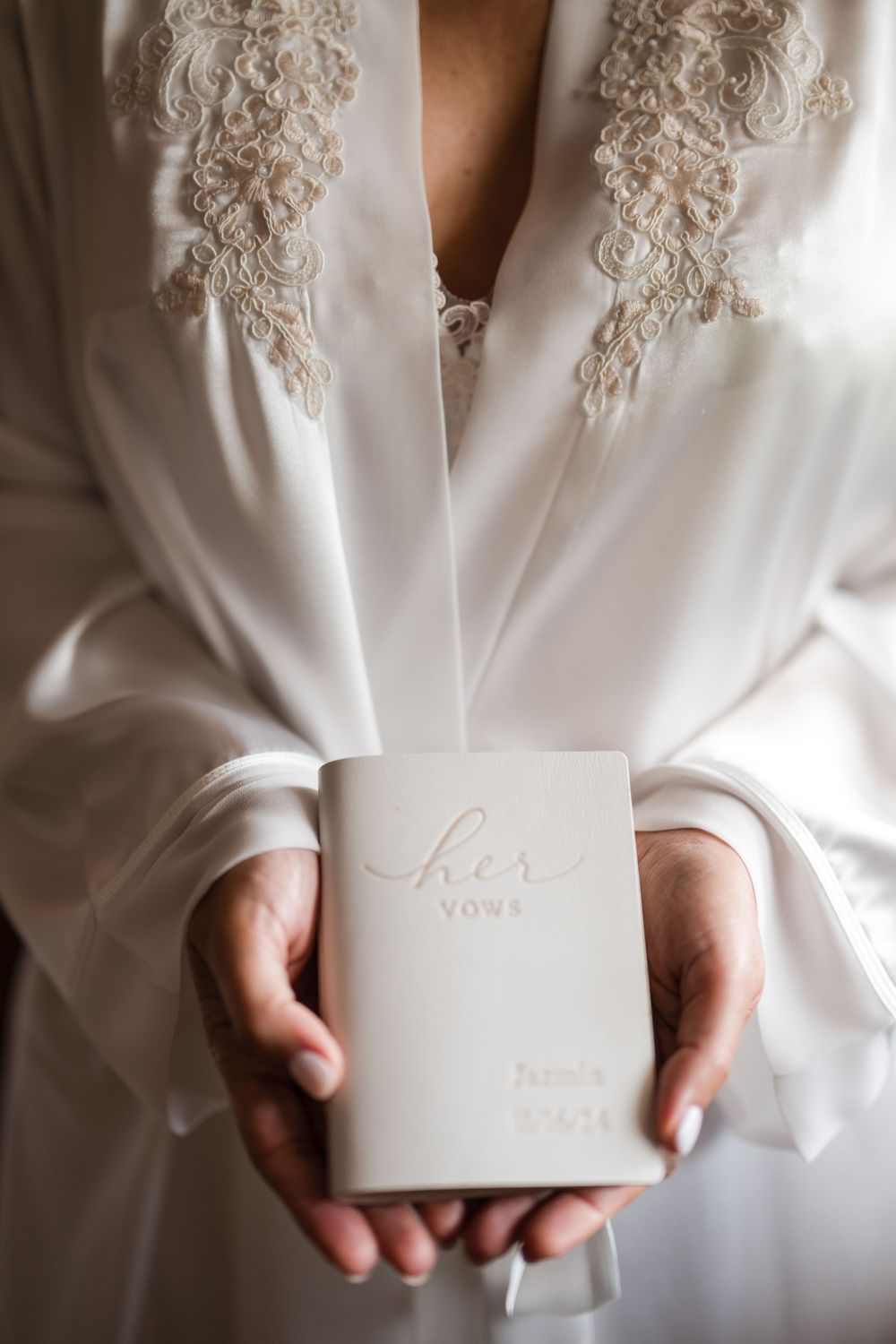 Bride holding her vows book