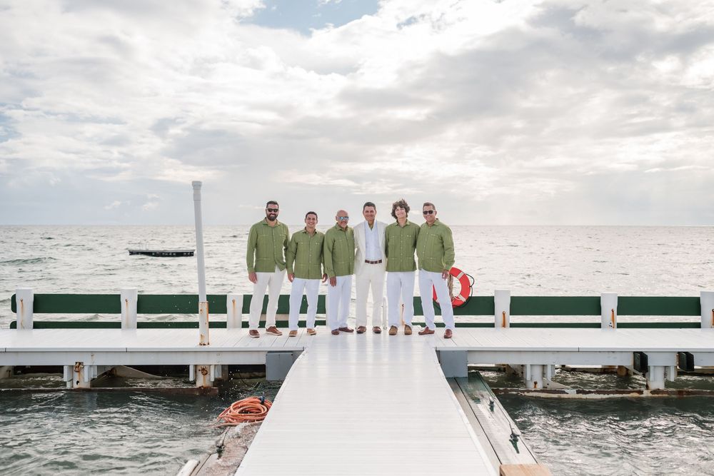 Groom walking with groomsmen at Copamarina wedding in Guanica Puerto Rico
