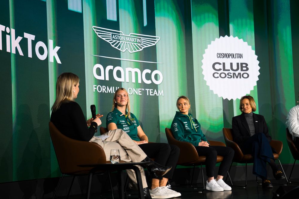 Corporate event stage with TikTok, Aramco and other brand logos displayed on green-lit backdrop.