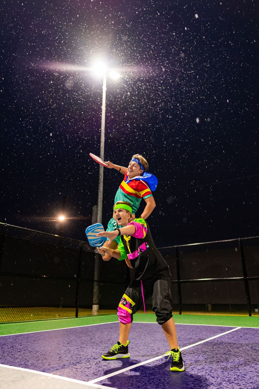 High-energy sports photography sequence showing acrobatic moves on an illuminated court.