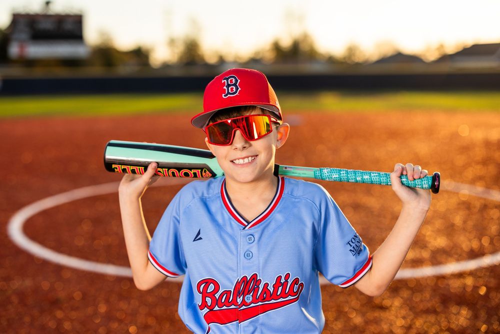 Youth baseball portrait using off-camera flash during a team media day in Lake Charles, LA. Ballistics at Westlake High School Field