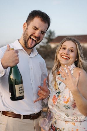 A joyful couple celebrates with champagne outdoors, showing off a ring in a series of candid engagement photos.