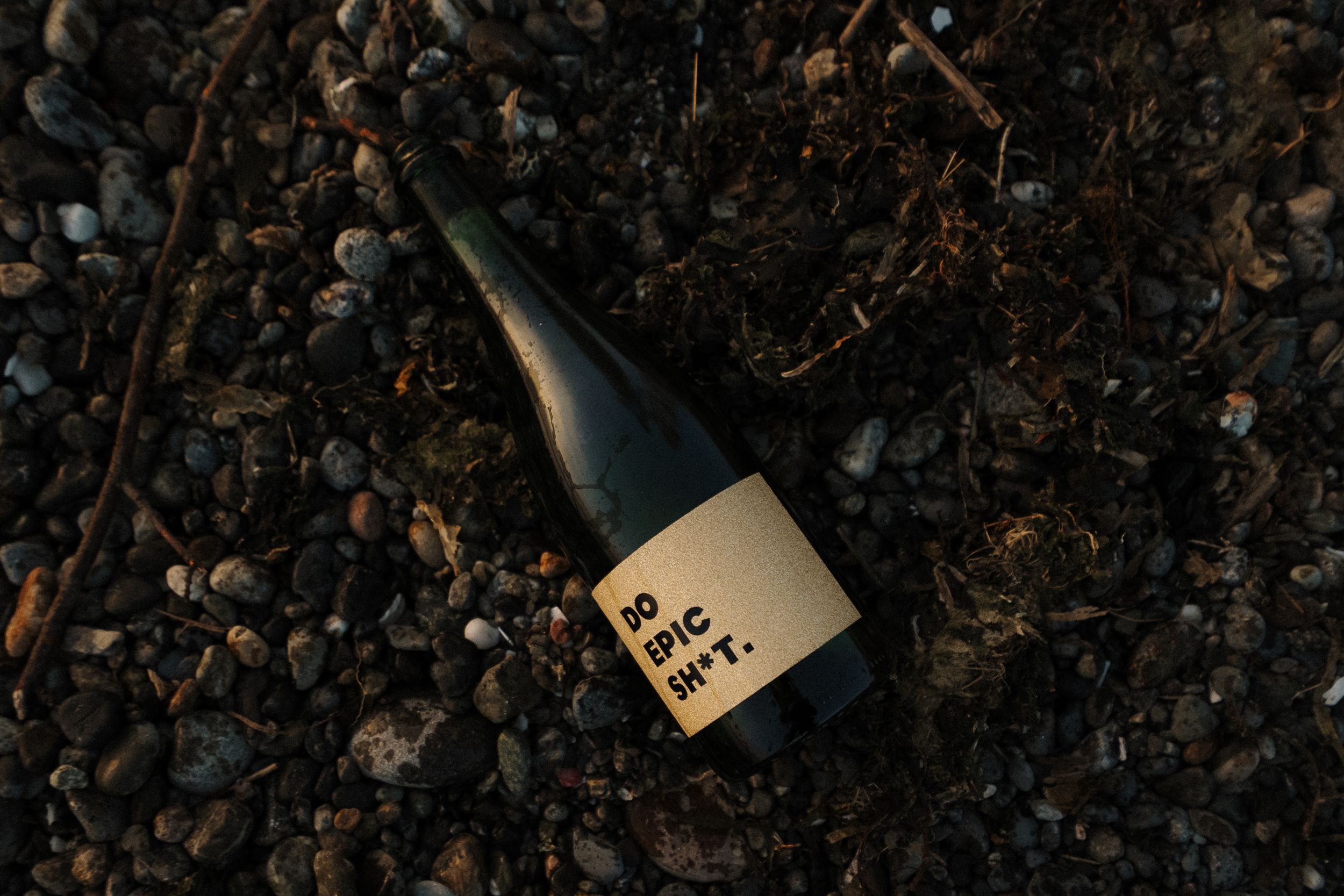 A dark textured background with scattered coffee beans and a small tag creates a rustic coffee-themed composition.