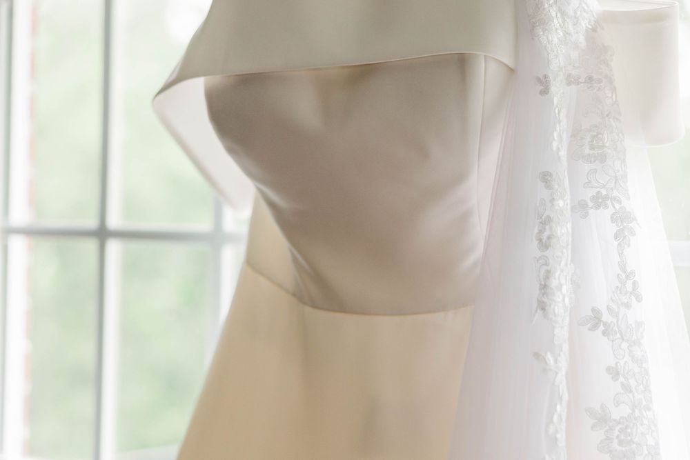 Close-up detail of a structured bodice on an elegant white wedding gown.