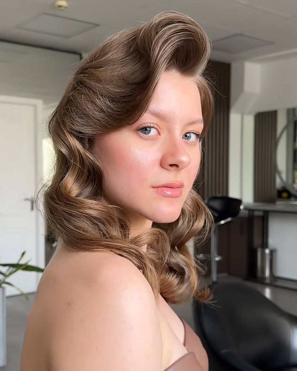 Cambridge bridal makeup artist creating soft glam wedding look.