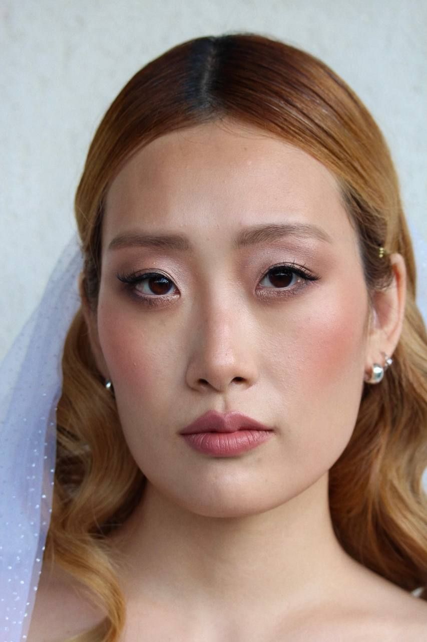 Cambridge bridal makeup artist creating soft glam wedding look.