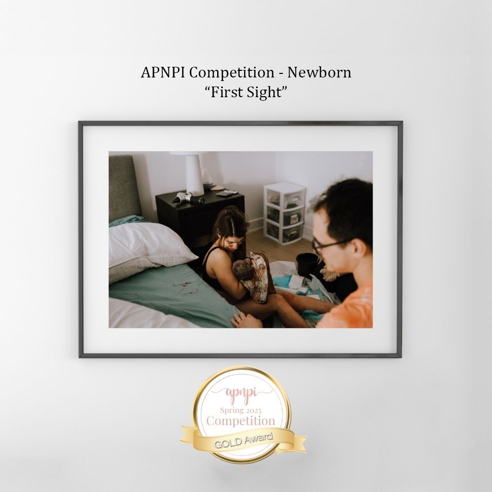 An award-winning photograph from a newborn photography competition shows a tender moment titled 'First Sight'.