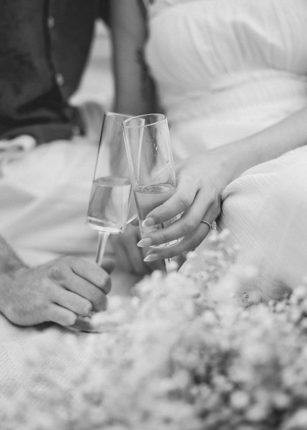 Champagne toast engagement session at the beach in Shediac New Brunswick professional photographer couples session romantic intimate moment