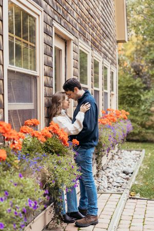 Couple embrace during candid moment in nature park, Moncton engagement photography packages near me, New Brunswick couple's photographer