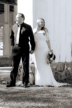 A series of black and white wedding photos showing a couple in formal attire standing by white columns outdoors.