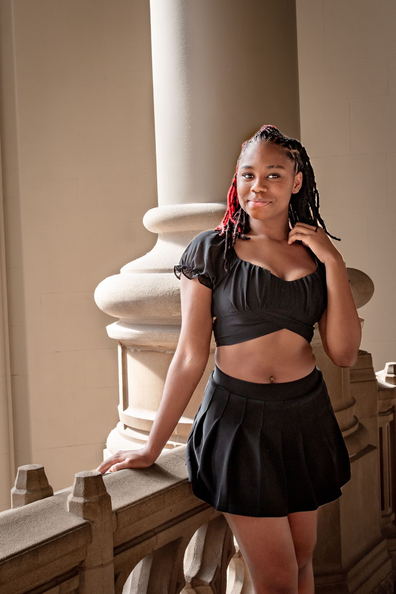Seattle senior portraits inside Suzzallo Library at University of Washington with warm natural light
