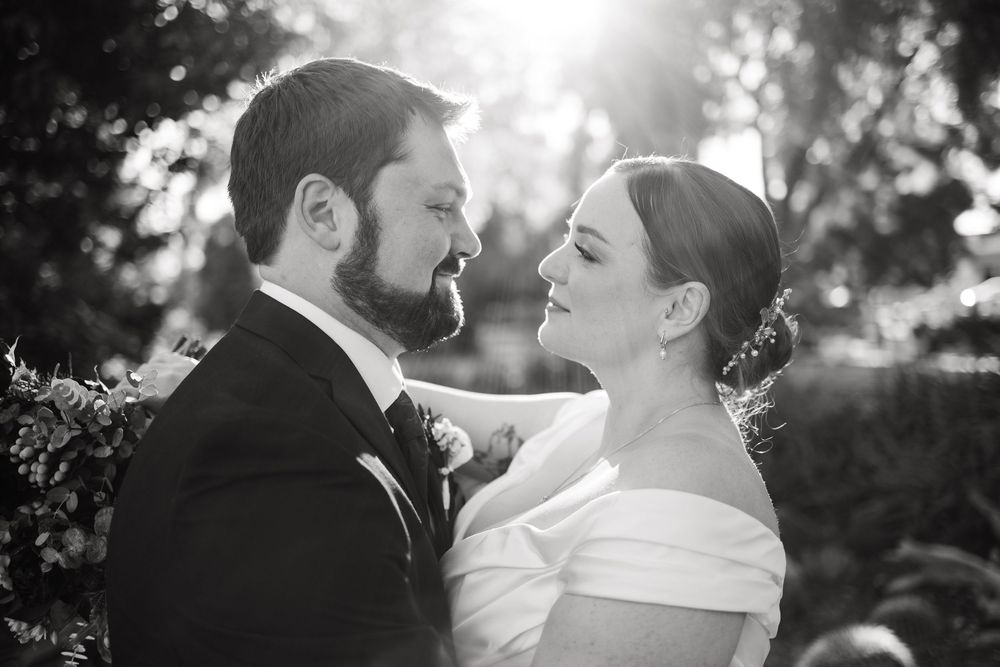 Romantic black and white wedding portraits captured in natural outdoor lighting.