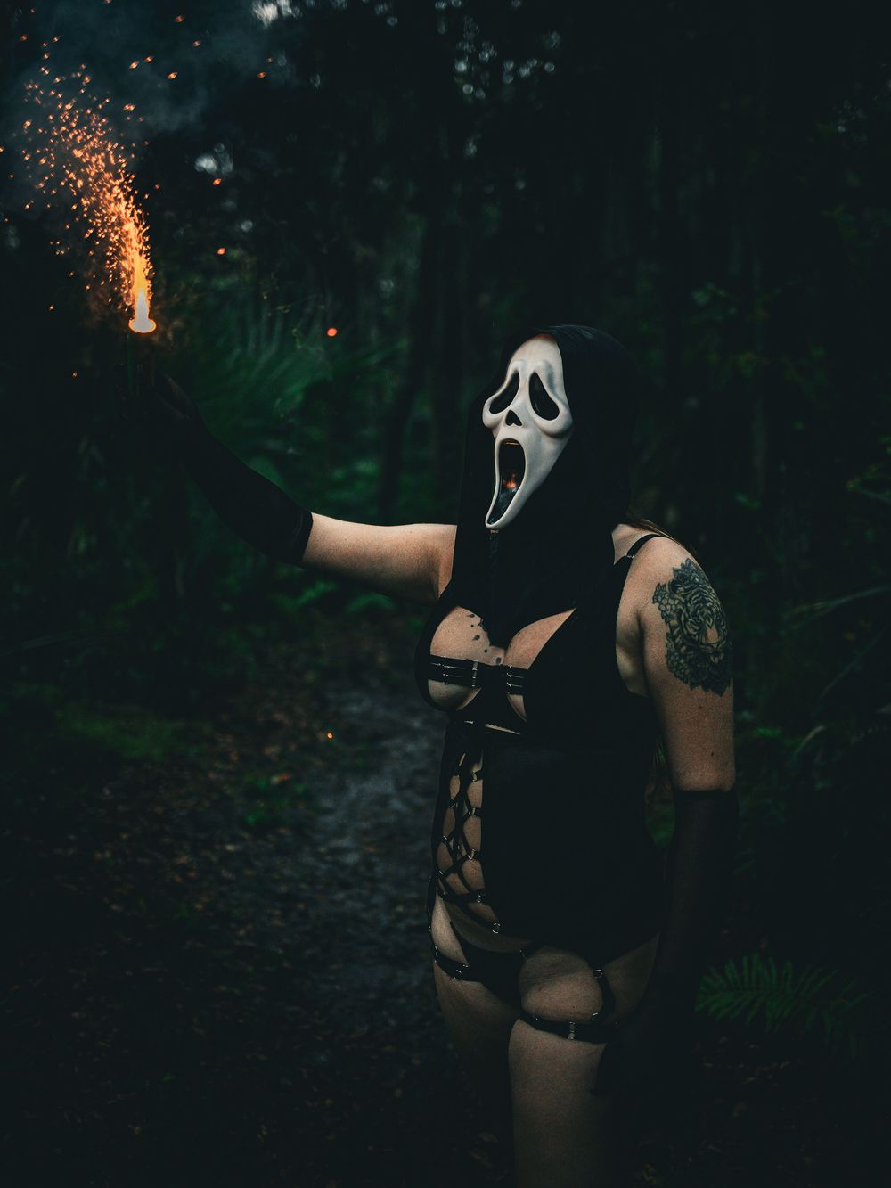 Dark atmospheric scene with ghost mask figure in shadowy forest setting.
